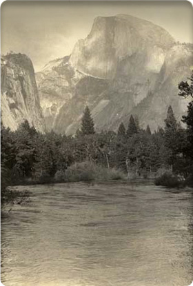 View of Half Dome in background, Merced River in foreground; ca. 1920.